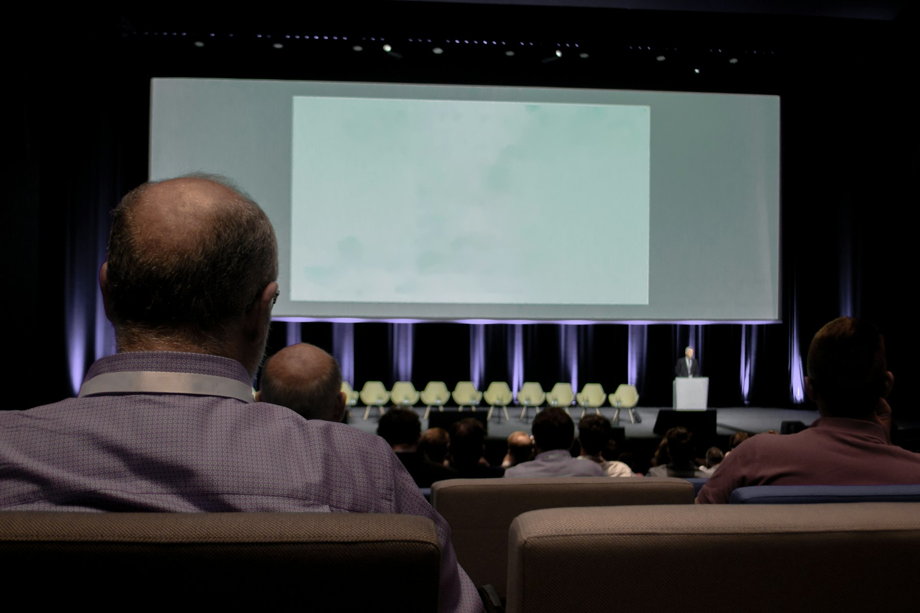 Healthcare leaders in a conference hall